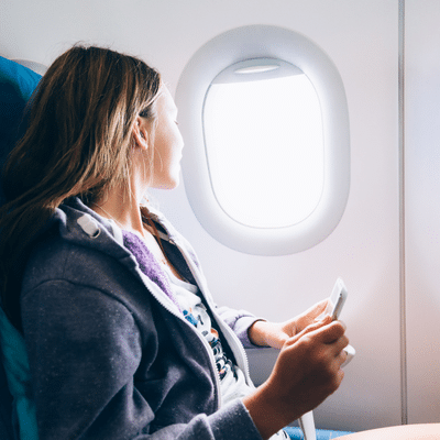 Commonwealth ent | richmond ent | midlothian ent 7 Woman looking out airplane window, representing how to prevent airplane ear